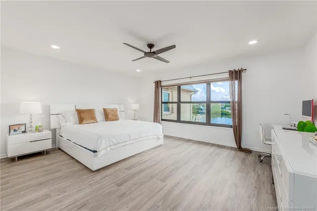 a bathroom with a double vanity sink mirror and toilet