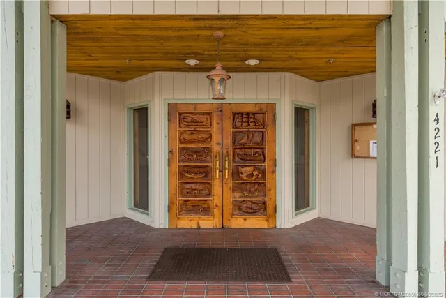 a view of a lake with chairs