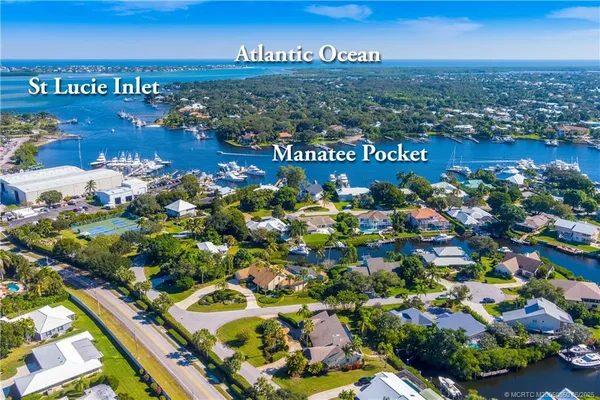 a view of a house with swimming pool and sitting area