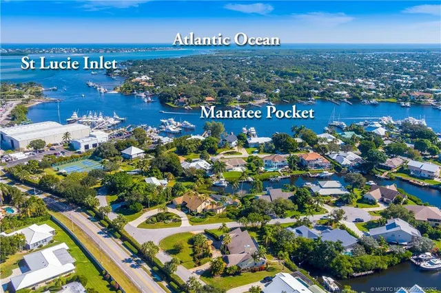 a view of a house with swimming pool and sitting area