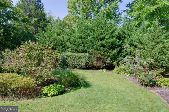 a view of a swimming pool with an outdoor seating