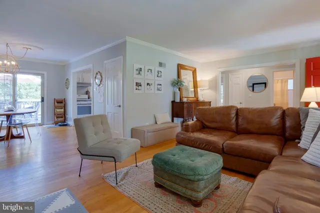 a living room with furniture flat screen tv and a fireplace