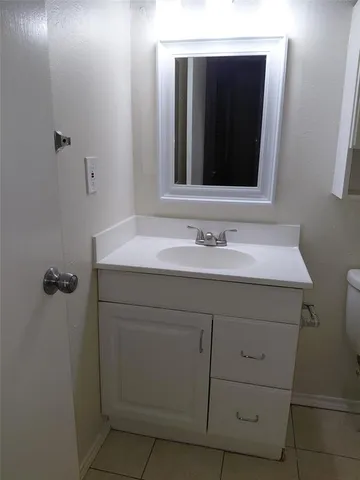 a bathroom with a shower a toilet and sink