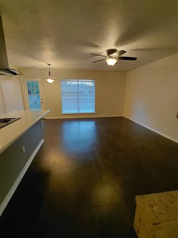 a view of a livingroom with wooden floor