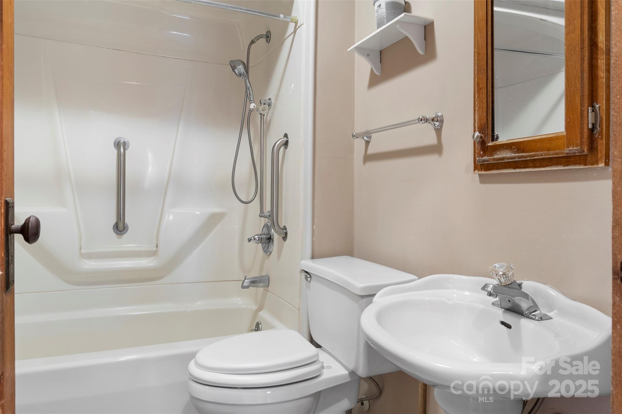 4601 Mooresville Road Kannapolis, NC 28081 - Photo 15 of 33 a bathroom with a sink toilet and shower