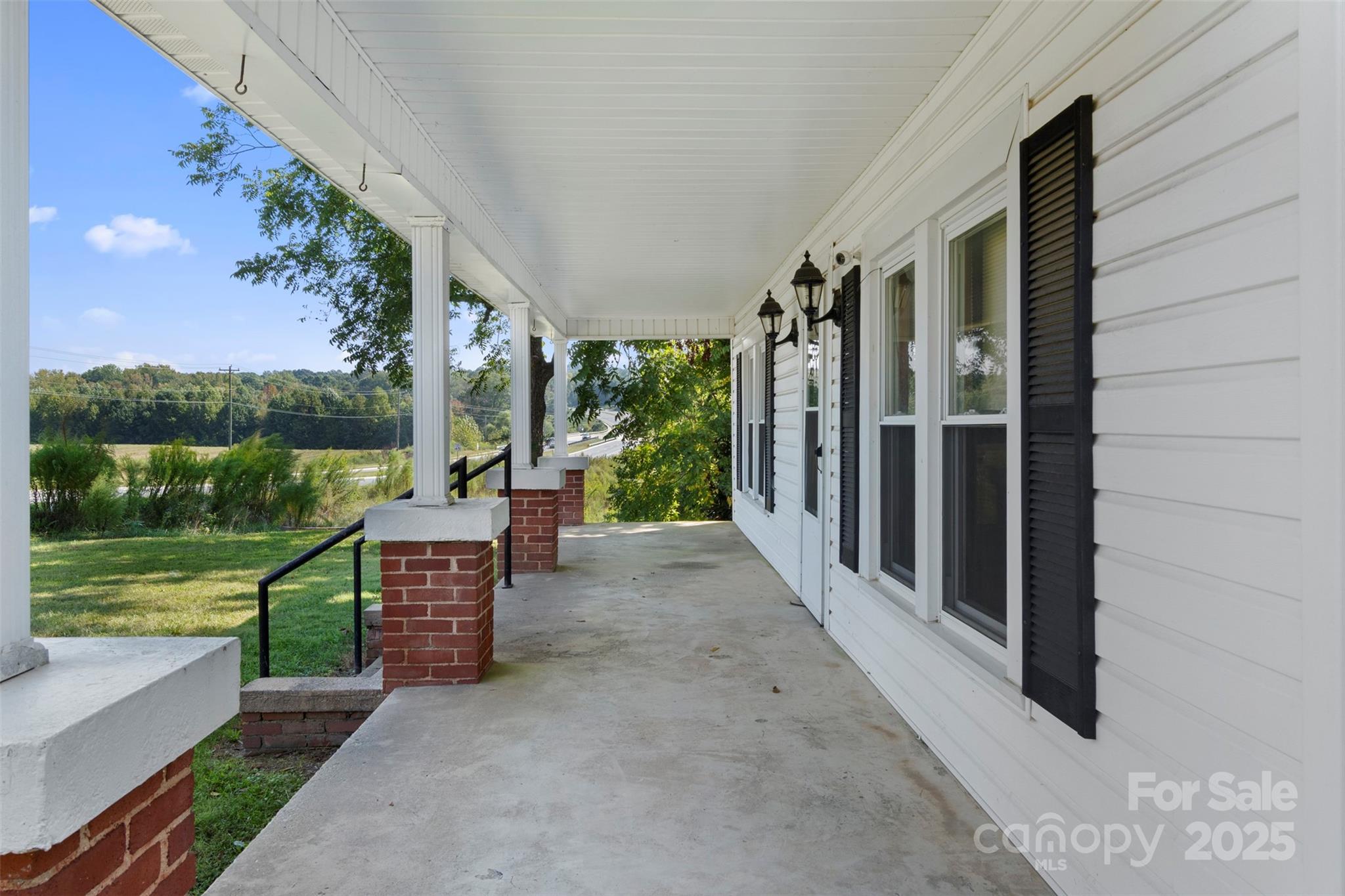 4601 Mooresville Road Kannapolis, NC 28081 - Photo 6 of 33 a view of a porch with furniture and garden