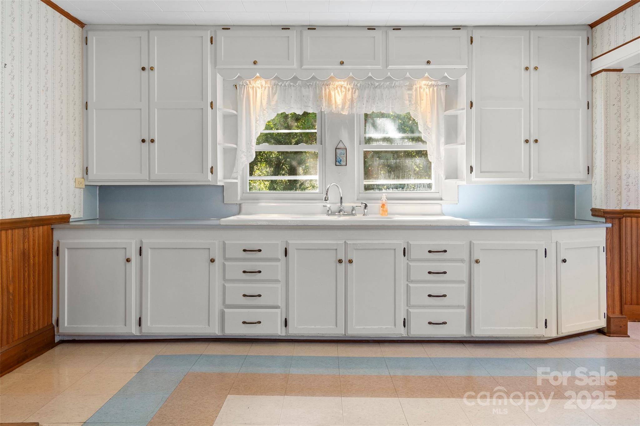 4601 Mooresville Road Kannapolis, NC 28081 - Photo 10 of 33 a kitchen with white cabinets and window