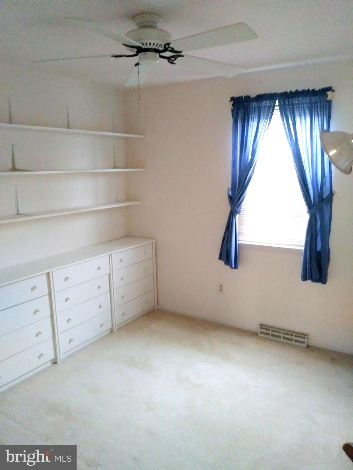 526 Holly Hunt Road Baltimore, MD 21220 - Photo 10 of 18 a view of an empty room with a window