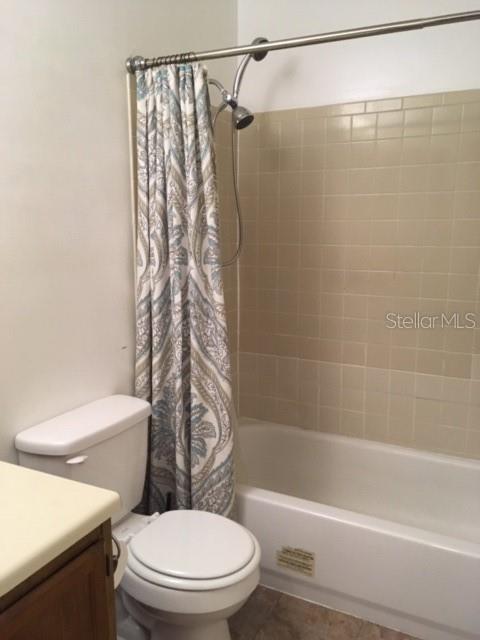 1712 Southwest 67th Terrace Gainesville, FL 32607 - Photo 8 of 10 a white toilet sitting next to a bath tub and a shower
