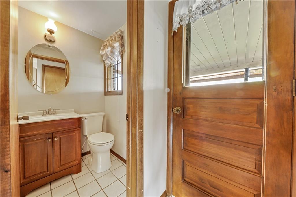 1004 Fiddleback Drive McKees Rocks, PA 15136 - Photo 13 of 25 a bathroom with a sink a toilet and shower