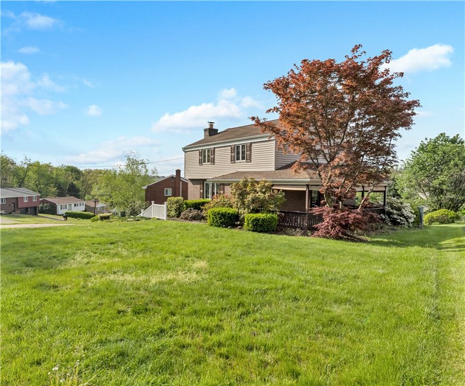 1004 Fiddleback Drive McKees Rocks, PA 15136 - Photo 2 of 25 a view of a house with a big yard plants and large trees