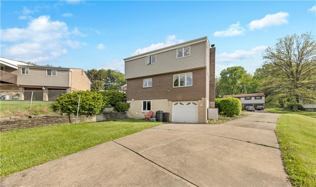 1004 Fiddleback Drive McKees Rocks, PA 15136 - Photo 24 of 25 a front view of a house with a yard