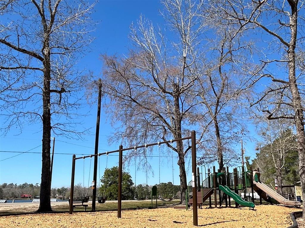 0 Royal Creek Road Conroe, TX 77303 - Photo 10 of 19 a view of a street with of a house