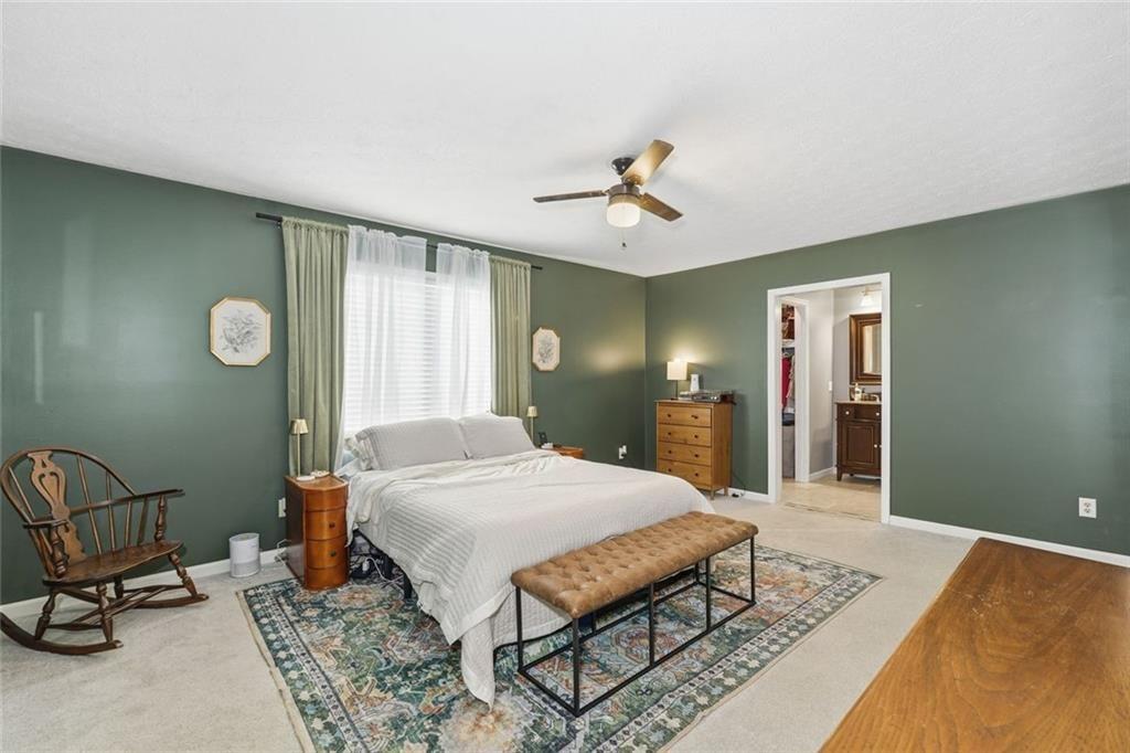 4766 McKee Court Southwest Mableton, GA 30126 - Photo 20 of 33 a bed room with a bed and chair