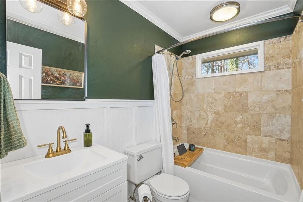 4766 McKee Court Southwest Mableton, GA 30126 - Photo 24 of 33 a bathroom with a sink a toilet and shower
