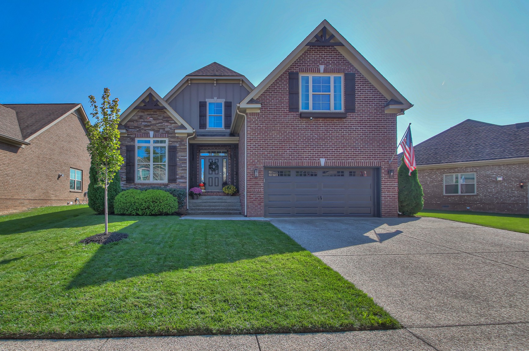 a front view of a house with garden