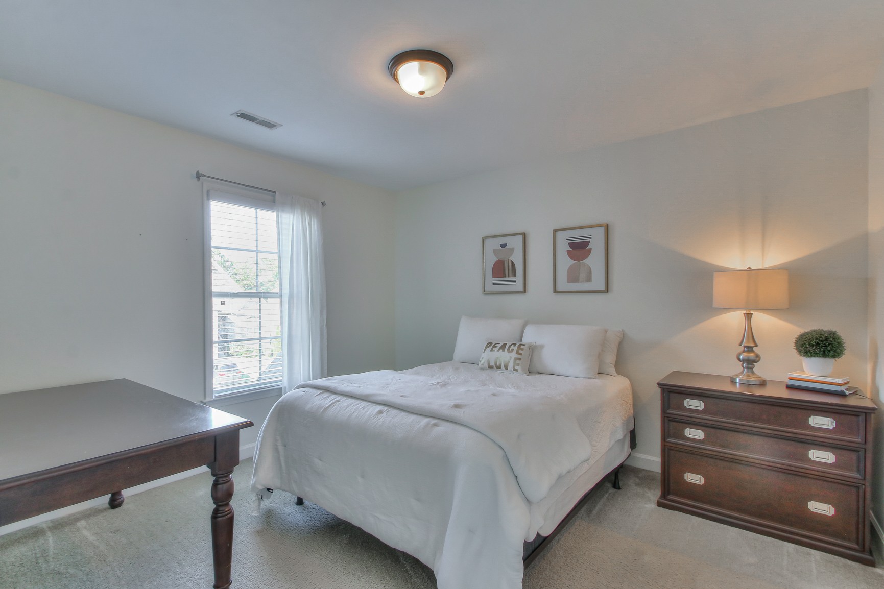 6032 Sanmar Drive Spring Hill, TN 37174 - Photo 24 of 29 a bedroom with a bed and a window