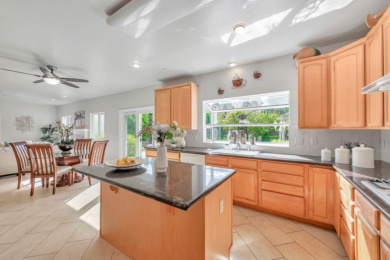 751 Pecan Way Campbell, CA 95008 - Photo 11 of 36 a kitchen with a sink window and cabinets