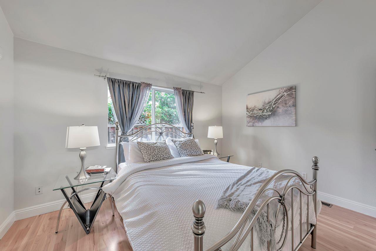 751 Pecan Way Campbell, CA 95008 - Photo 14 of 36 a bedroom with a bed and wooden floor