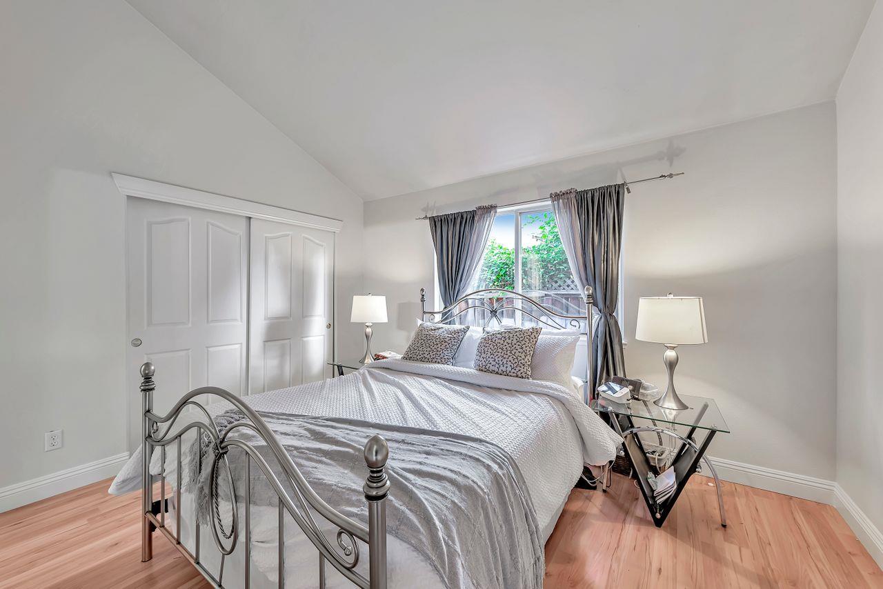 751 Pecan Way Campbell, CA 95008 - Photo 15 of 36 a bedroom with a bed a table and windows