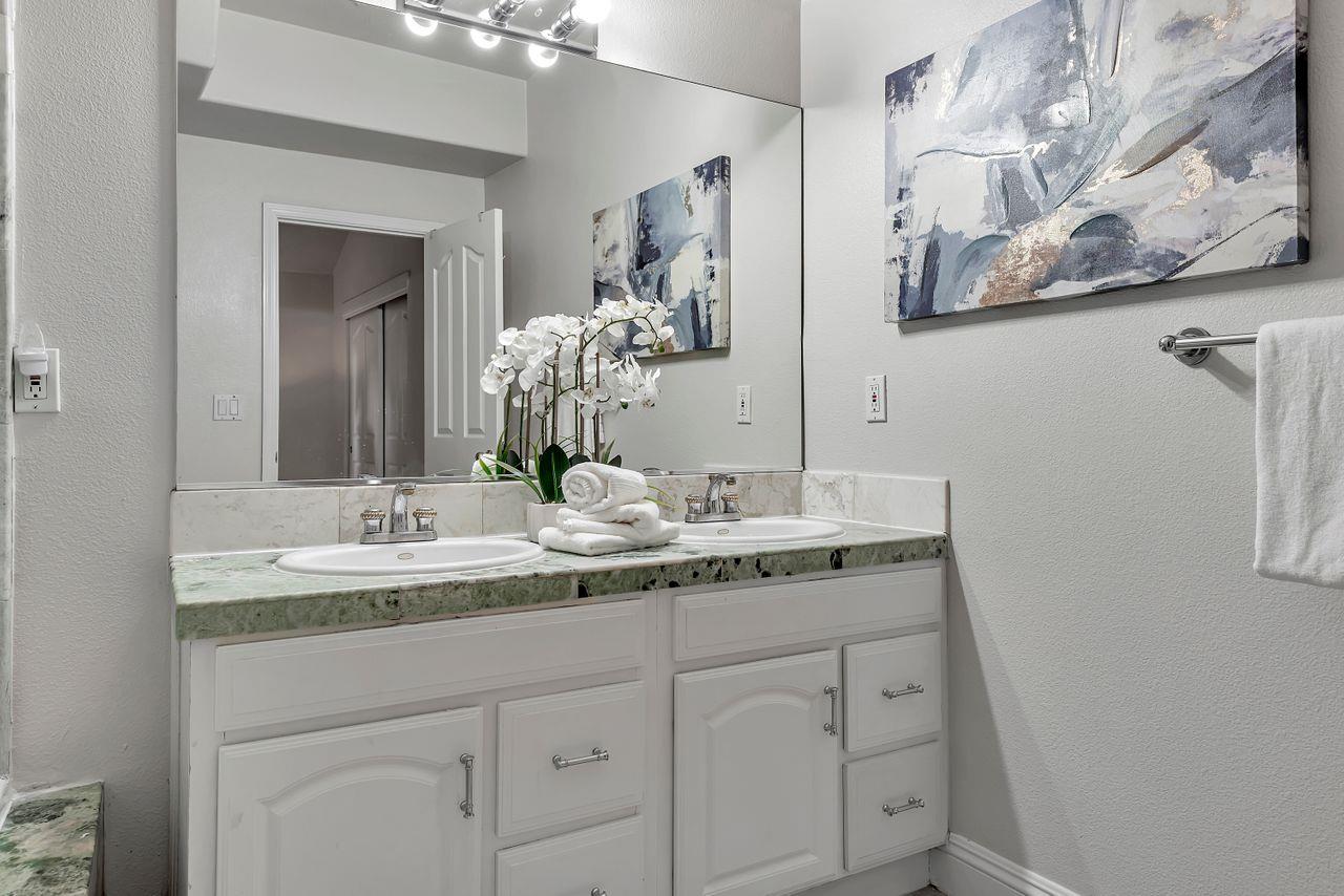 751 Pecan Way Campbell, CA 95008 - Photo 16 of 36 a bathroom with a granite countertop sink and a mirror