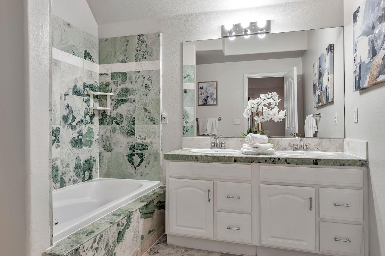 751 Pecan Way Campbell, CA 95008 - Photo 17 of 36 a bathroom with a granite countertop sink and a mirror