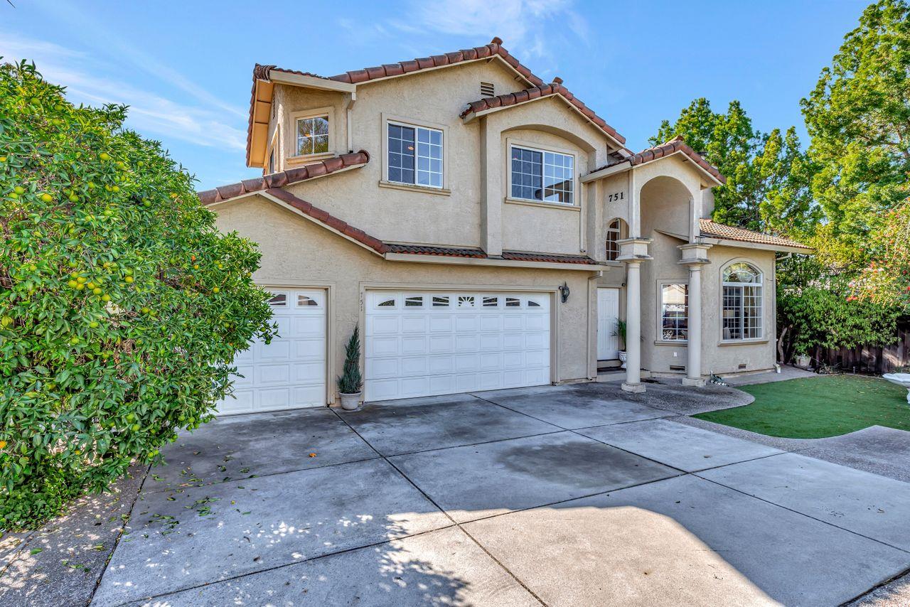 751 Pecan Way Campbell, CA 95008 - Photo 2 of 36 a front view of a house with a yard and garage