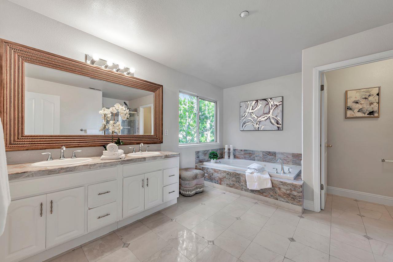 751 Pecan Way Campbell, CA 95008 - Photo 23 of 36 a bathroom with a toilet sink and mirror