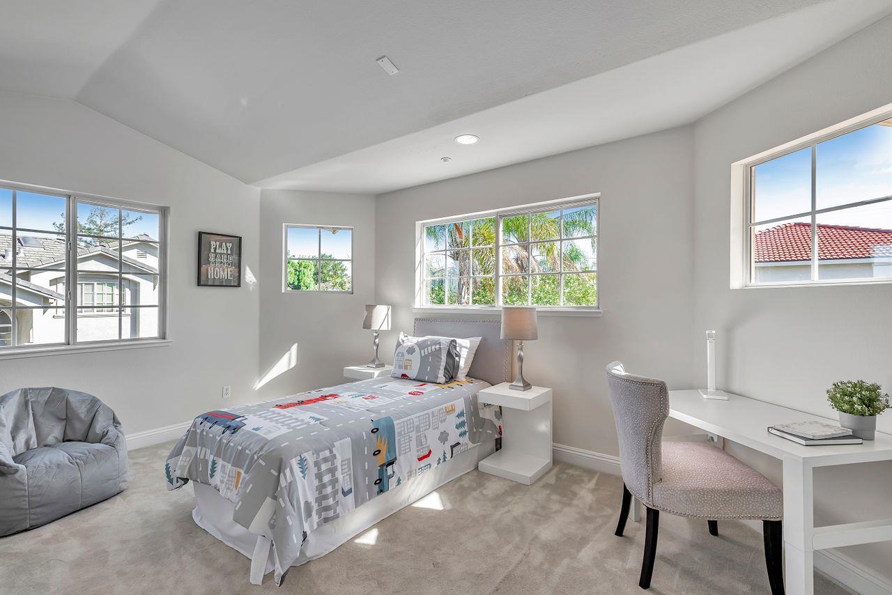 751 Pecan Way Campbell, CA 95008 - Photo 26 of 36 a bedroom with a bed a table and chair