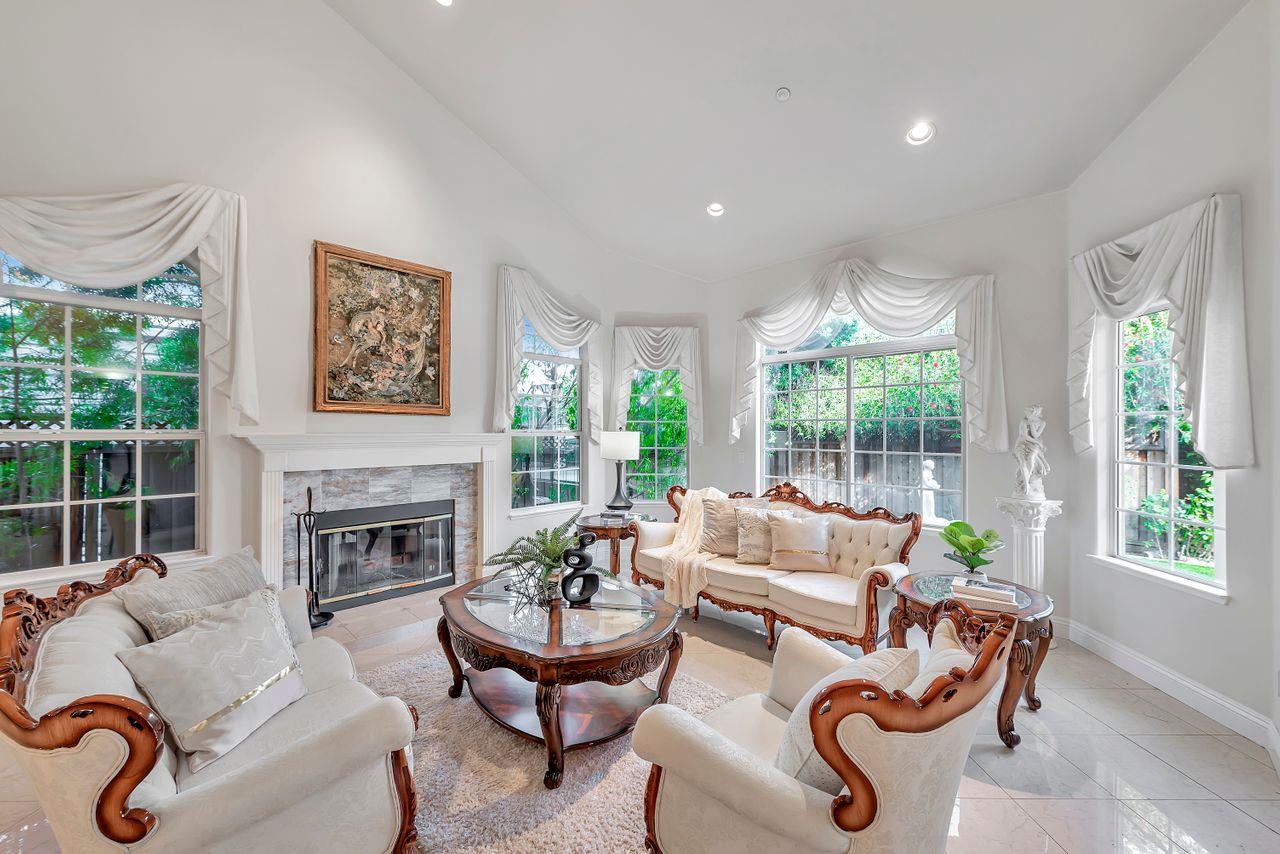 751 Pecan Way Campbell, CA 95008 - Photo 4 of 36 a living room with furniture fireplace and a large window