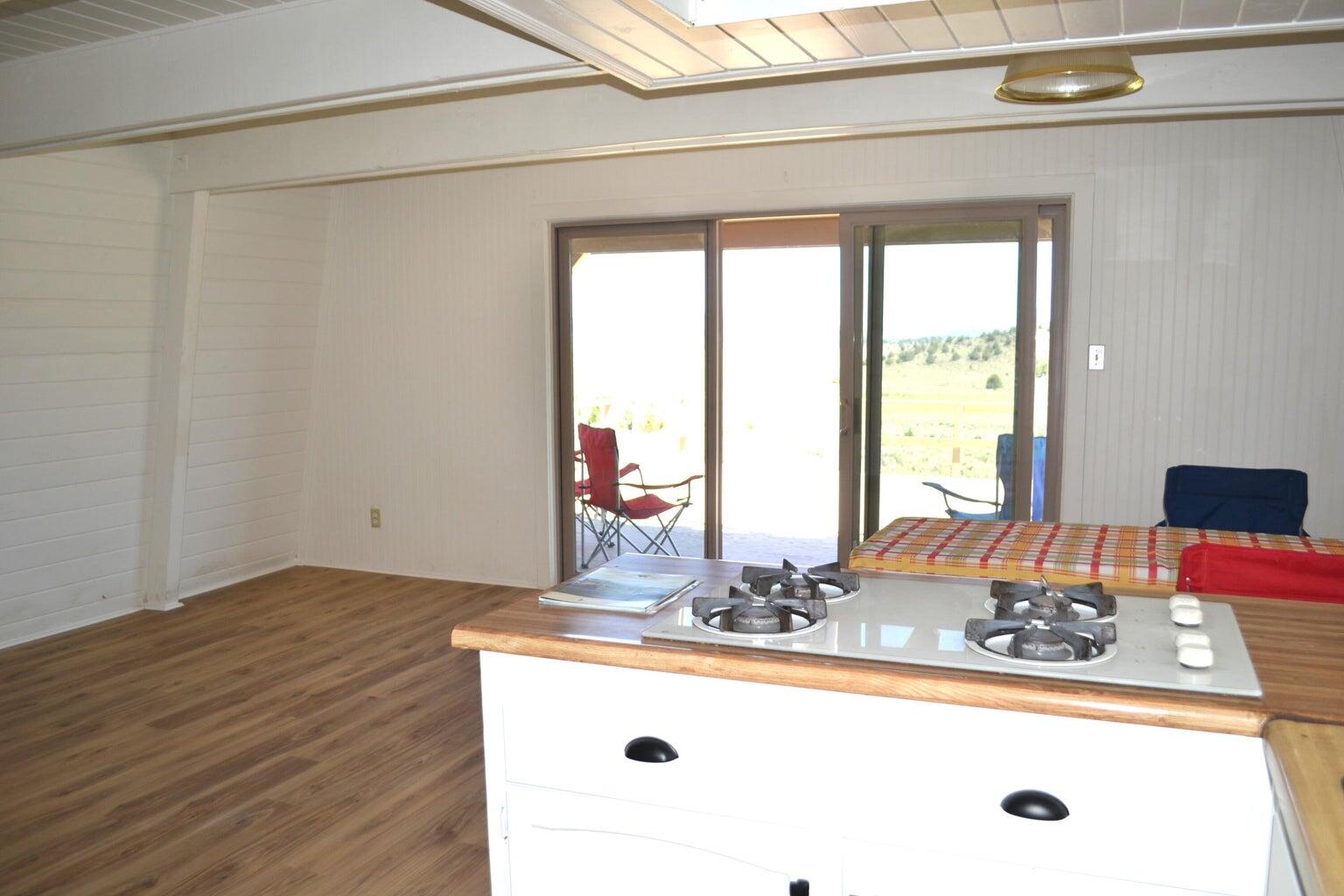 523-400 South Grasshopper Road Termo, CA 96132 - Photo 14 of 44 a dining table with a large window