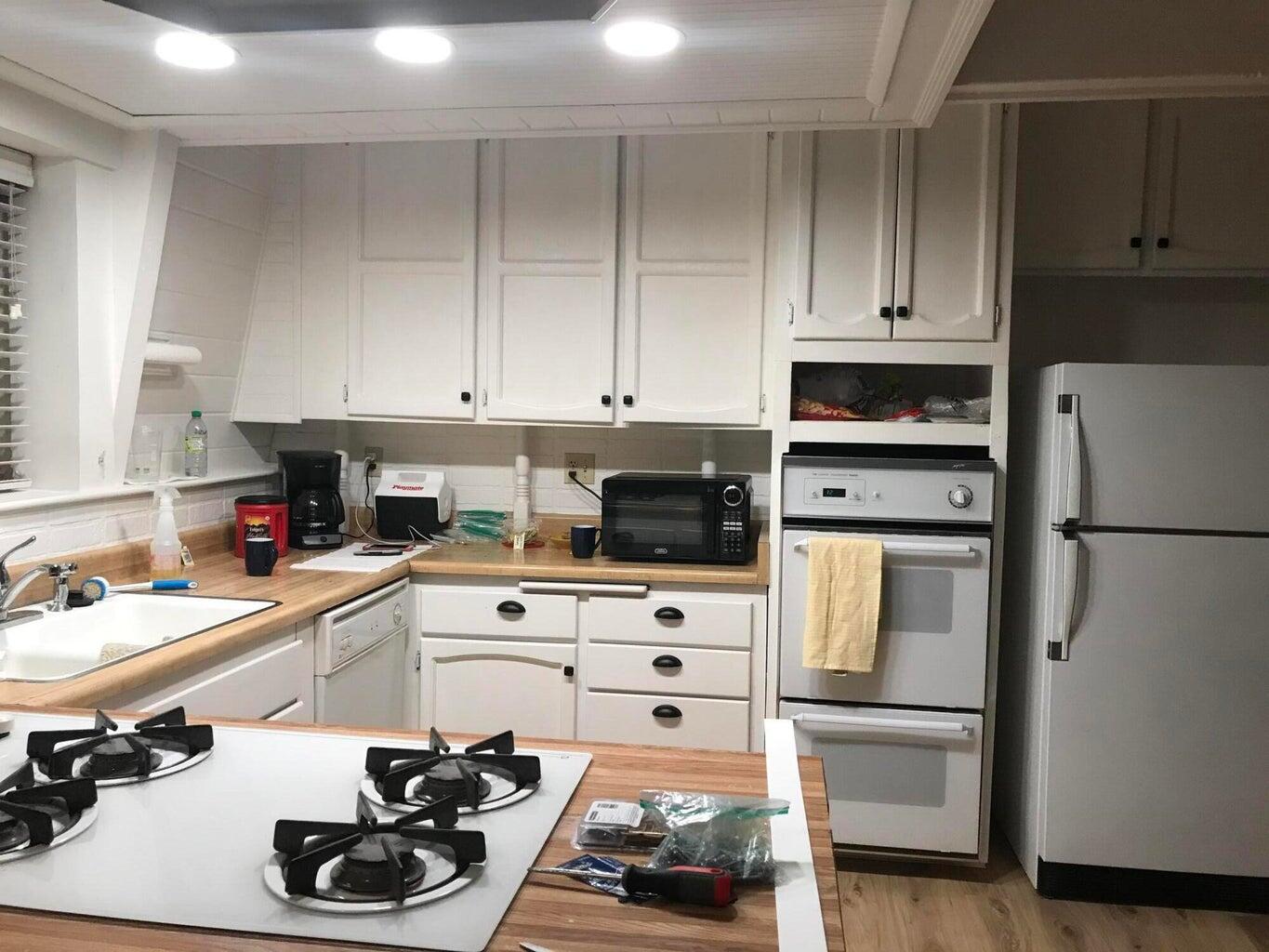 523-400 South Grasshopper Road Termo, CA 96132 - Photo 15 of 44 a kitchen with a sink appliances and cabinets