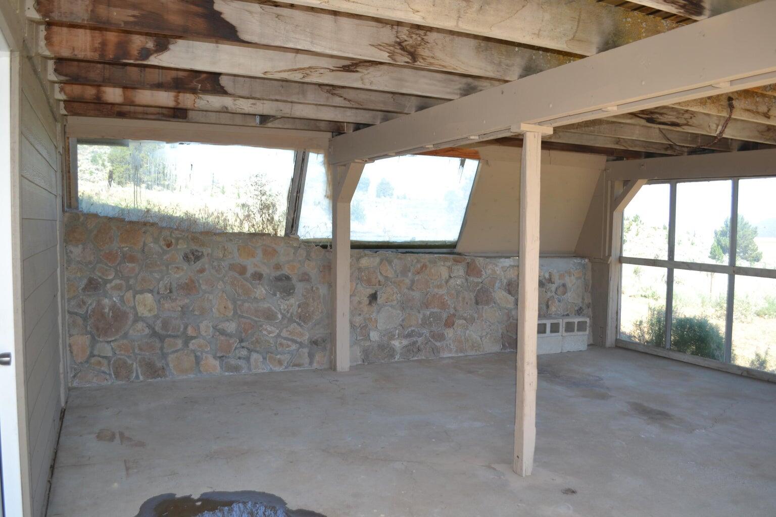 523-400 South Grasshopper Road Termo, CA 96132 - Photo 33 of 44 a view of an empty room with a sliding door