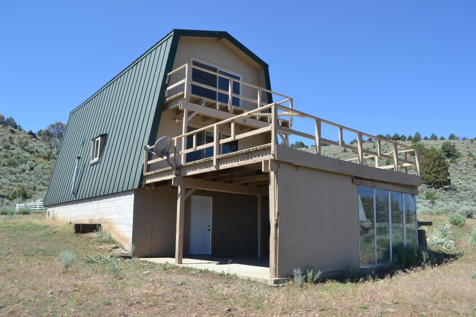 523-400 South Grasshopper Road Termo, CA 96132 - Photo 36 of 44 a front view of a house with a yard