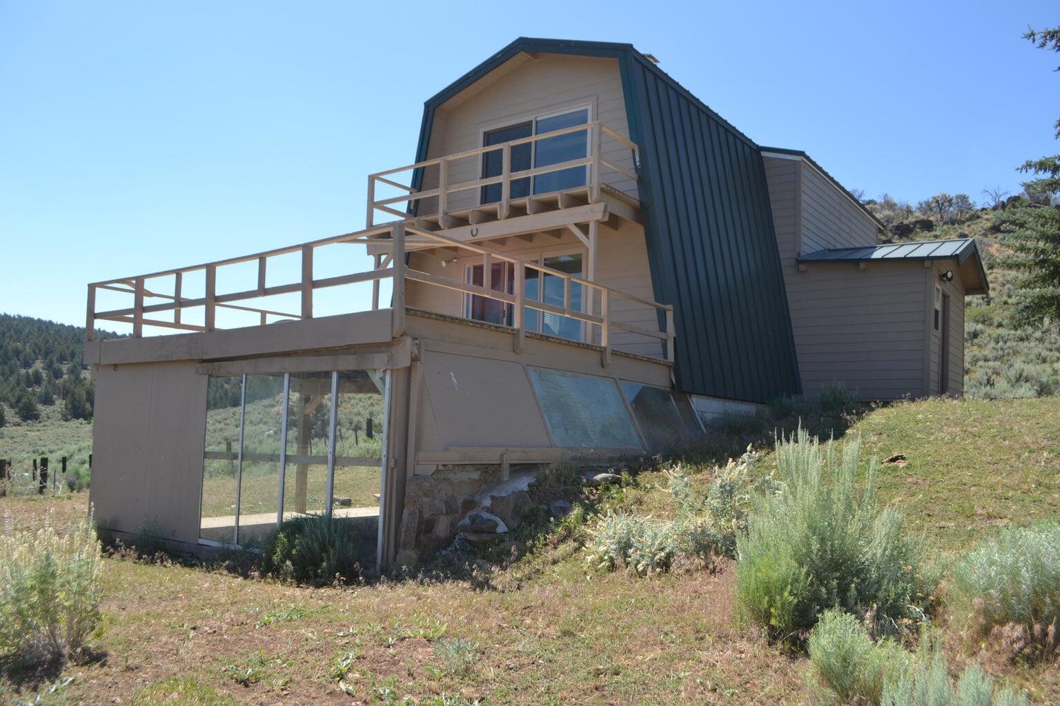523-400 South Grasshopper Road Termo, CA 96132 - Photo 5 of 44 a front view of a house with a yard