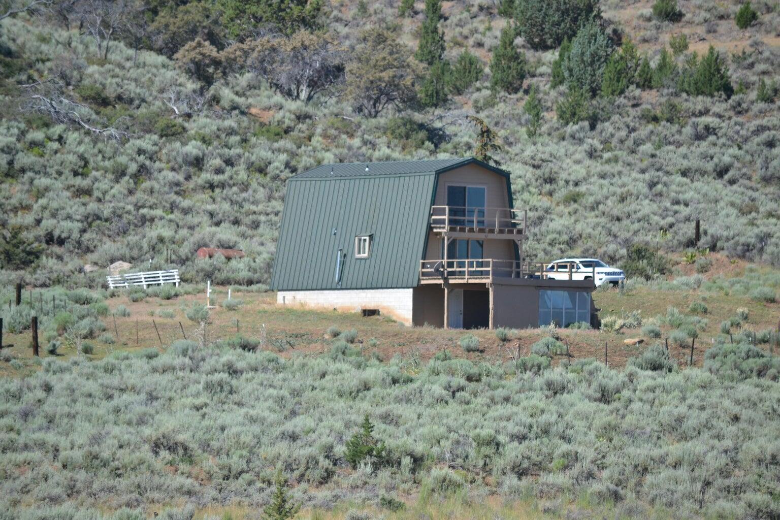 523-400 South Grasshopper Road Termo, CA 96132 - Photo 6 of 44 a view of a wooden house with a yard
