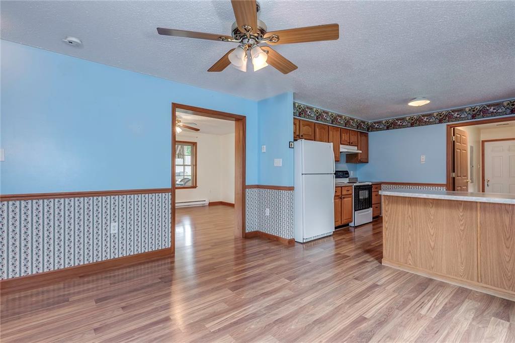 16 Allison Road Bulger, PA 15019 - Photo 9 of 24 Wood Look Laminate Flows Throughout Living Space