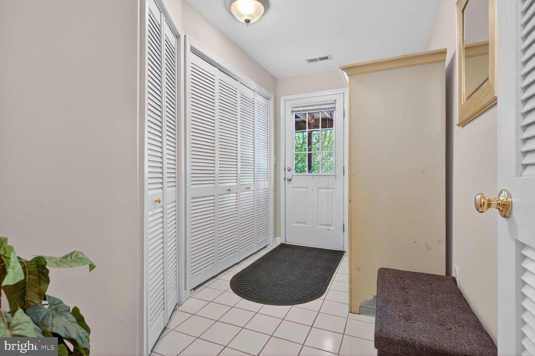 1343 Argall Place Alexandria, VA 22314 - Photo 27 of 35 Rear entrance mudroom with wardrobe and bench