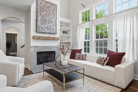 a living room with furniture and a fireplace