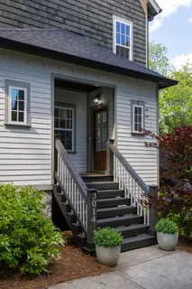a view of a house with wooden deck