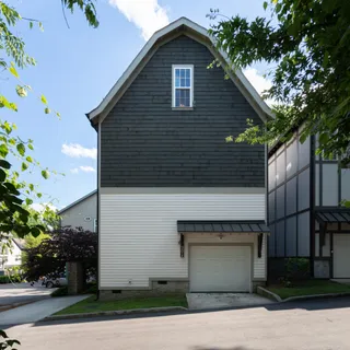 a front view of a house with garage