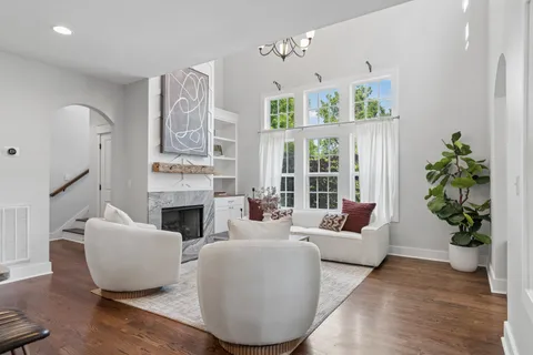 a living room with furniture and a fireplace