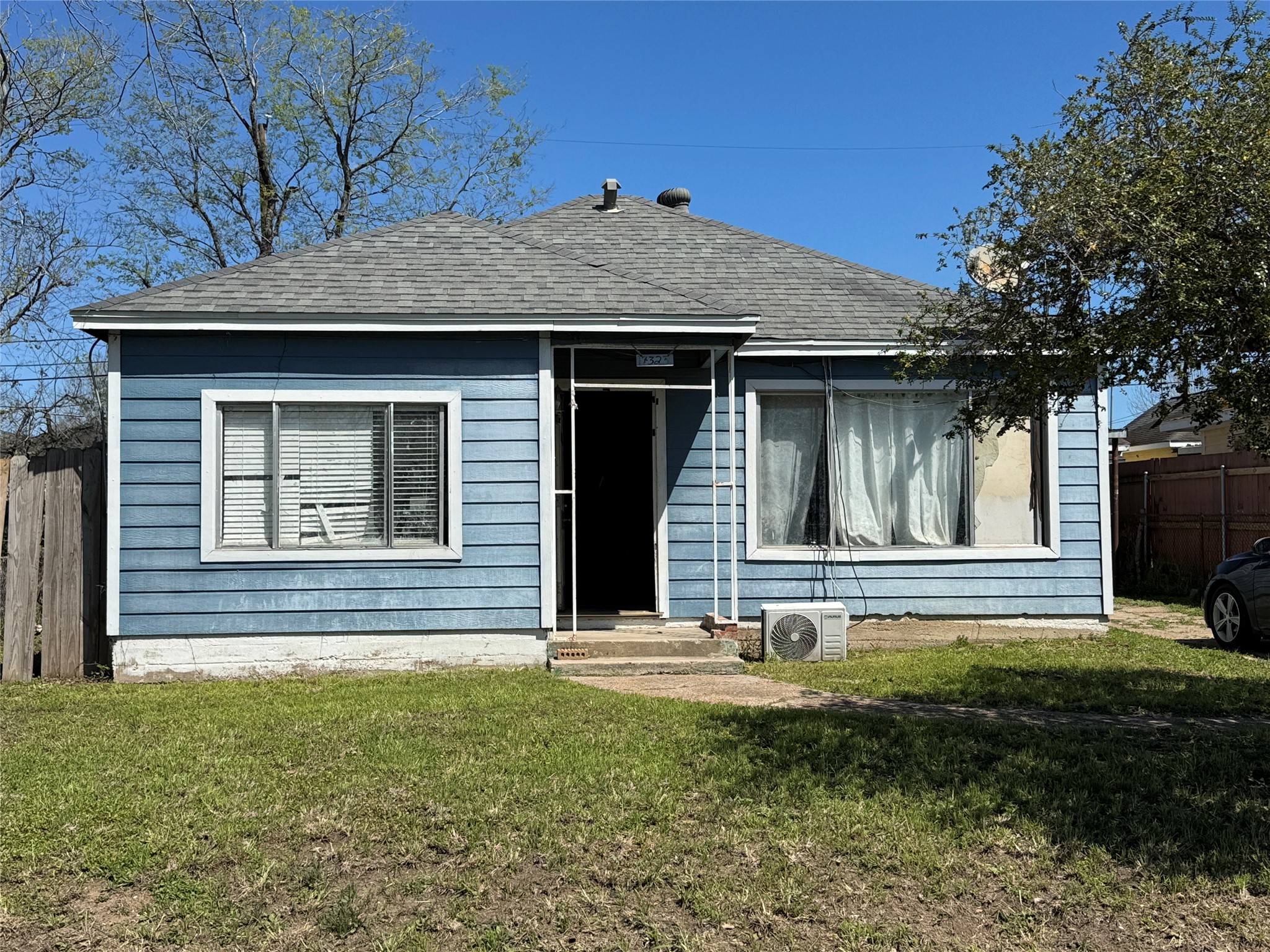 7323 Dallas Street Houston, TX 77011 - Photo 1 of 8 a front view of a house with garden