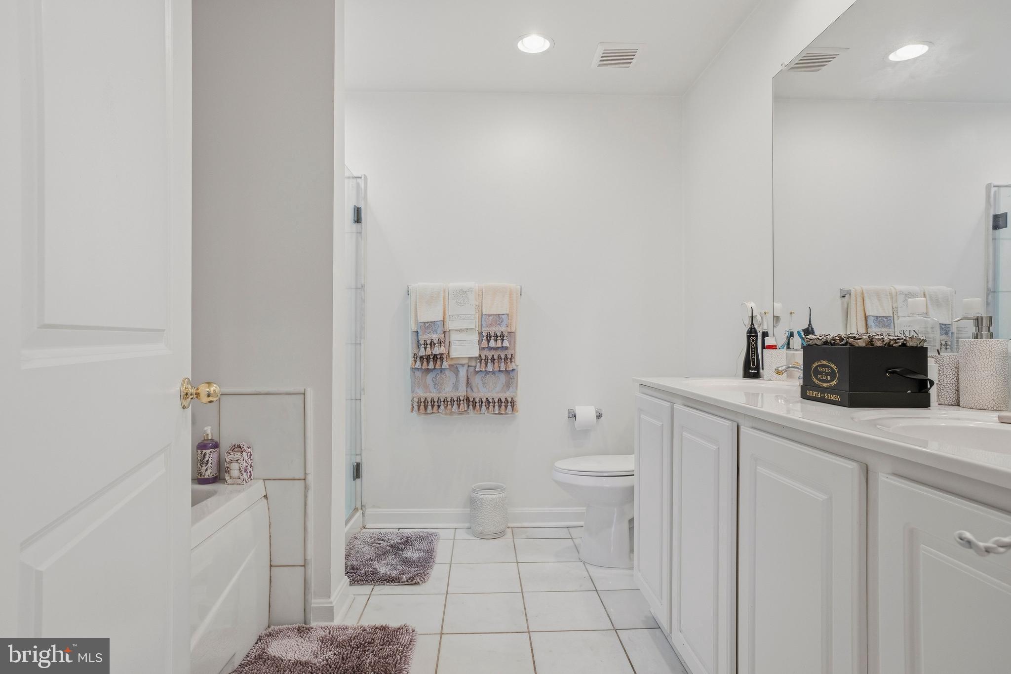 9500 Sidebrook Road, Unit 406 Owings Mills, MD 21117 - Photo 25 of 36 Sumptuous bath with soaking tub and stall shower