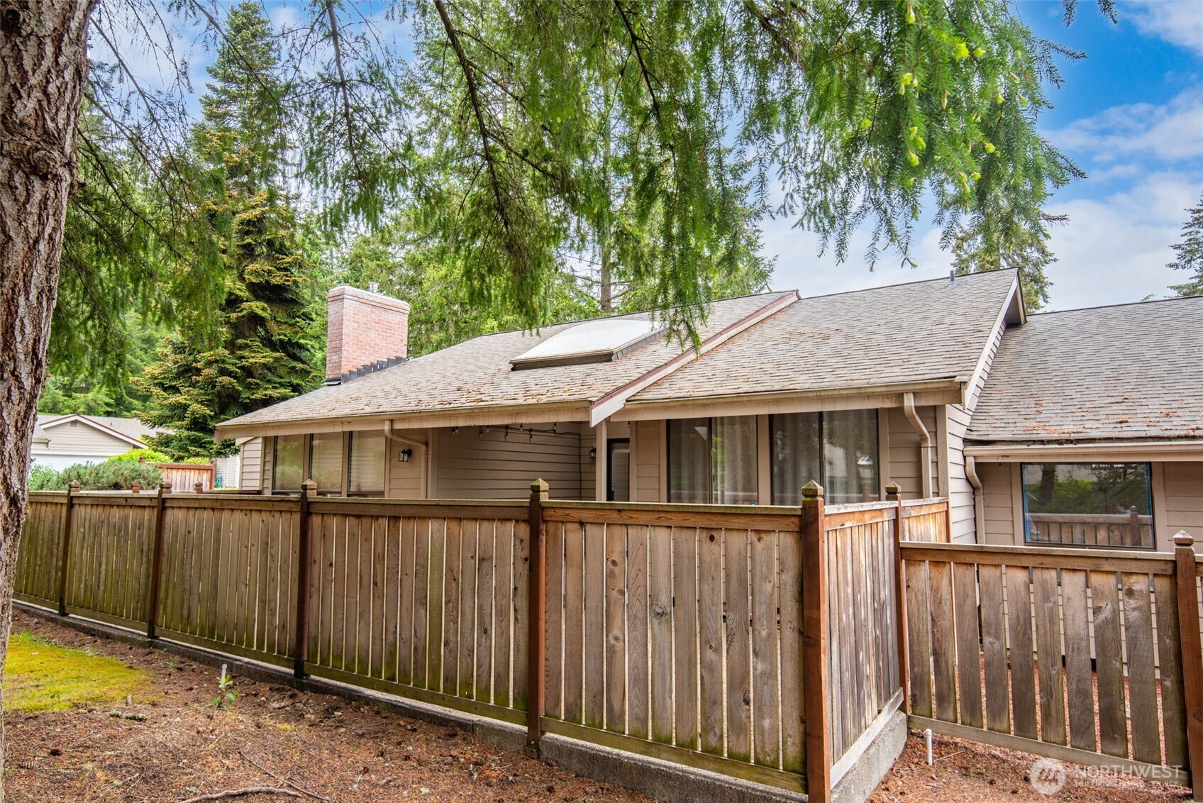 1322 Boise Street Fircrest, WA 98466 - Photo 40 of 40 a backyard of a house with wooden fence