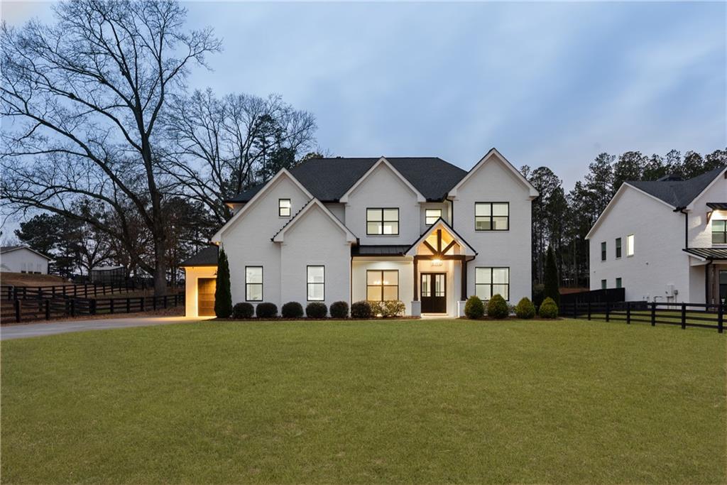 2381 Jones Phillips Road Dacula, GA 30019 - Photo 2 of 57 a front view of a house with a yard