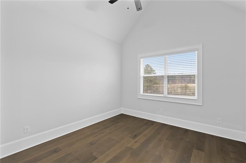 2381 Jones Phillips Road Dacula, GA 30019 - Photo 29 of 57 an empty room with wooden floor and windows
