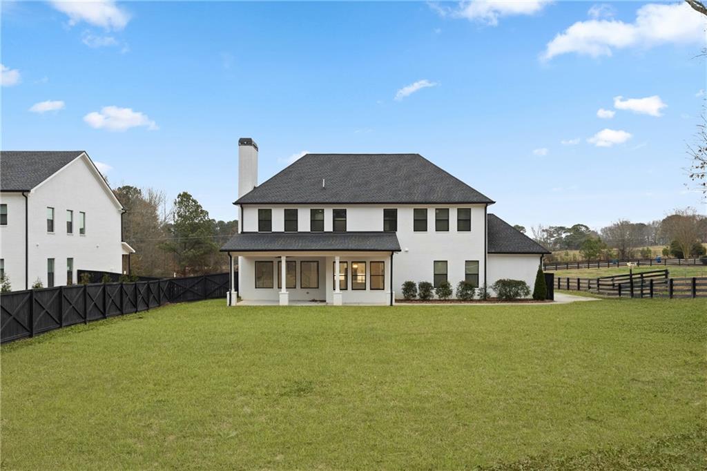 2381 Jones Phillips Road Dacula, GA 30019 - Photo 47 of 57 a front view of a house with a yard