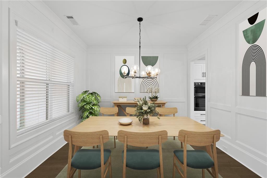 2381 Jones Phillips Road Dacula, GA 30019 - Photo 8 of 57 a view of a dining room with furniture and chandelier