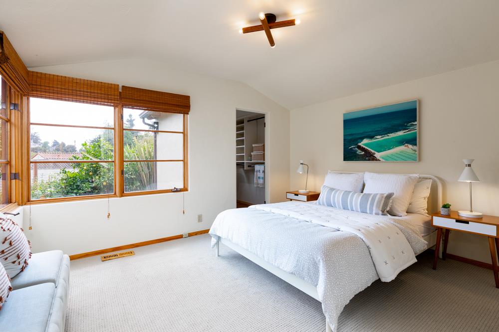 244 Aptos Beach Drive Aptos, CA 95003 - Photo 12 of 32 a bedroom with a bed and a large window